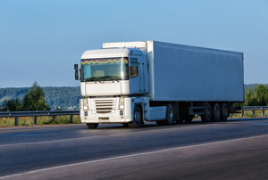 white moving truck headed long distance